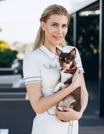 beautiful-modern-blonde-holds-a-small-dog-in-her-2021-12-24-01-05-34-utc-1.jpg